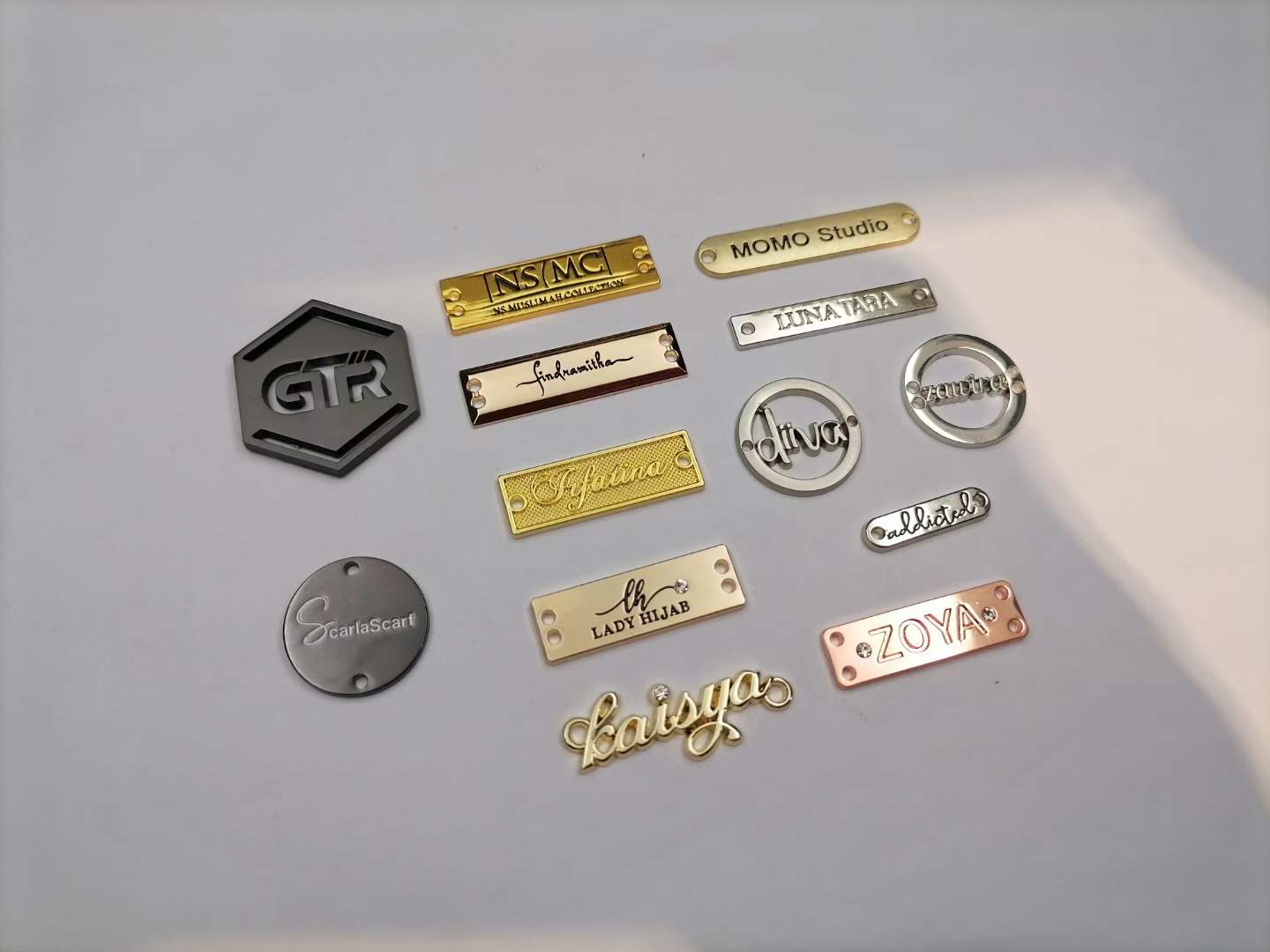 IMG-20240803-WA0027 Name Metal Tag Custom Logo Metal Label Tag For Clothing Swimwear in uae